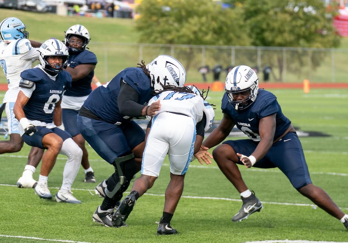 Lincoln University football players defend against Upper Iowa while playing the Homecoming game.