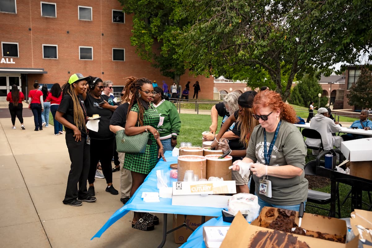 People line up to get ice cream at the Homecoming ice cream social.