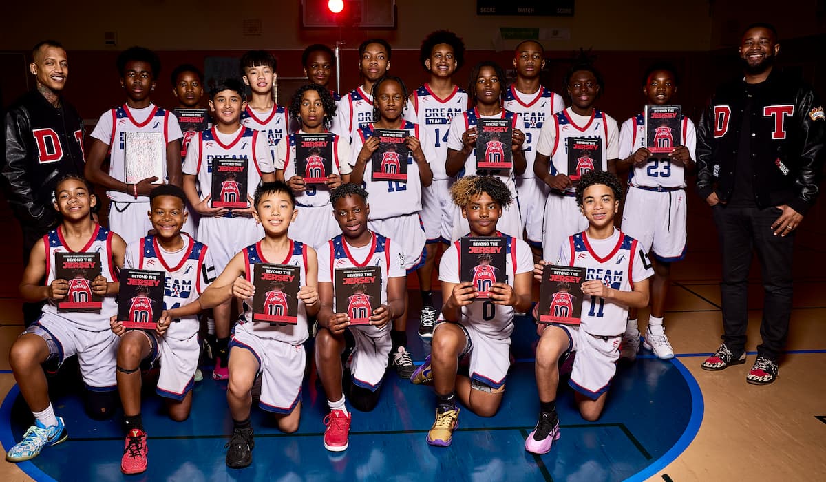 Members of the Dream Team youth basketball program pose together during a team event.